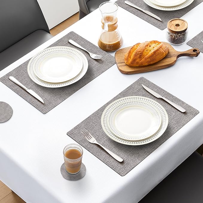MOSAYT Placemats Set of 8, Heat Resistant Vinyl Place Mats with Coasters, Wipeable Washable 100% Waterproof Oil Proof Faux Leather Table Mats for Kitchen Dining Party Outdoor, 12" x 17", Light Grey