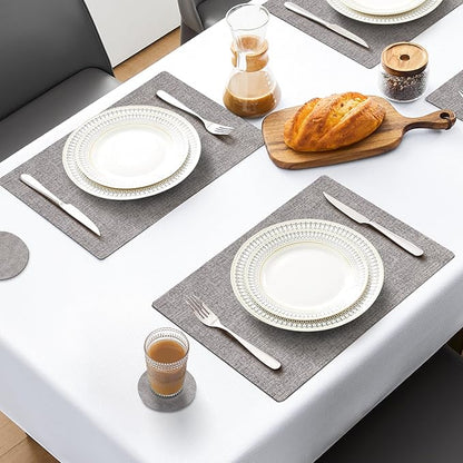 MOSAYT Placemats Set of 8, Heat Resistant Vinyl Place Mats with Coasters, Wipeable Washable 100% Waterproof Oil Proof Faux Leather Table Mats for Kitchen Dining Party Outdoor, 12" x 17", Light Grey